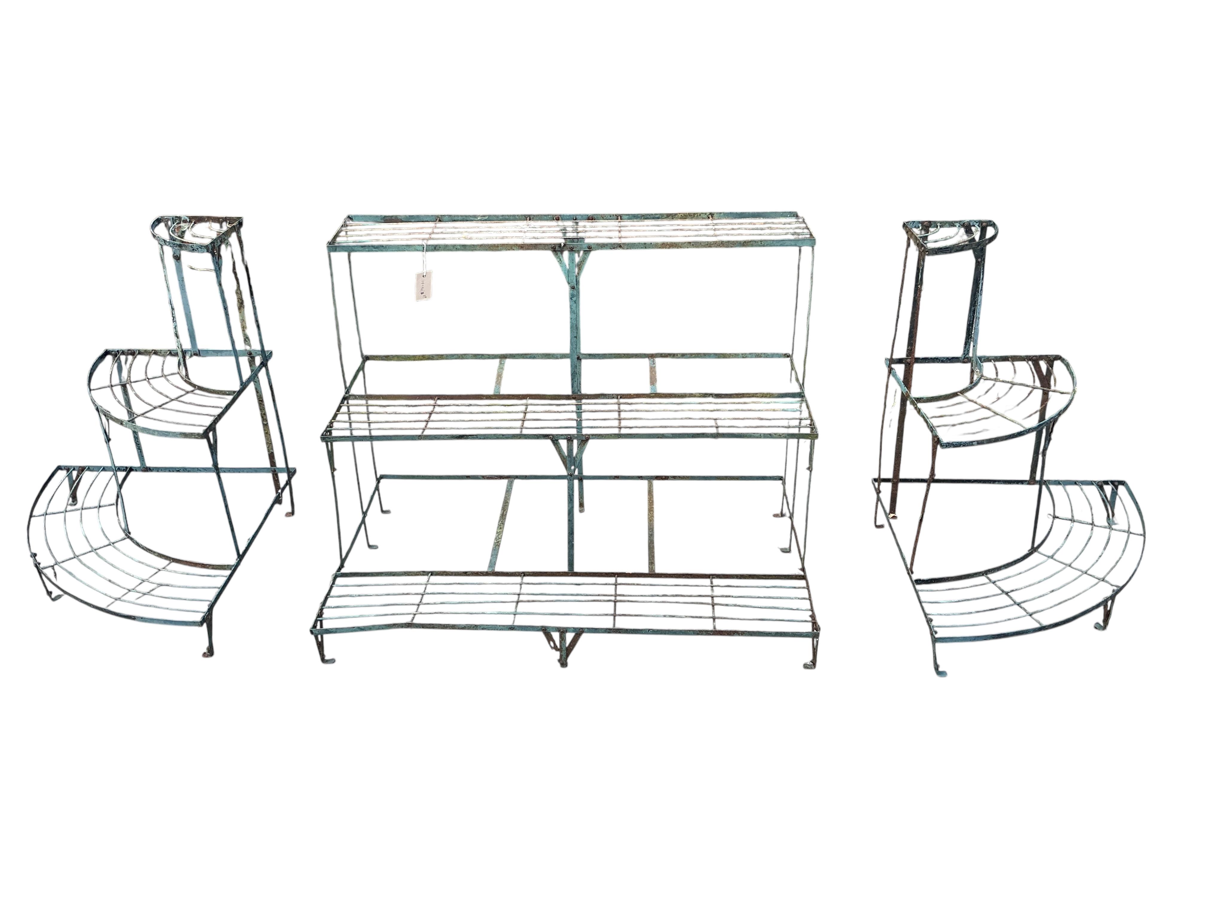 A wrought iron three section three tier pot stand, width 108cm, height 75cm